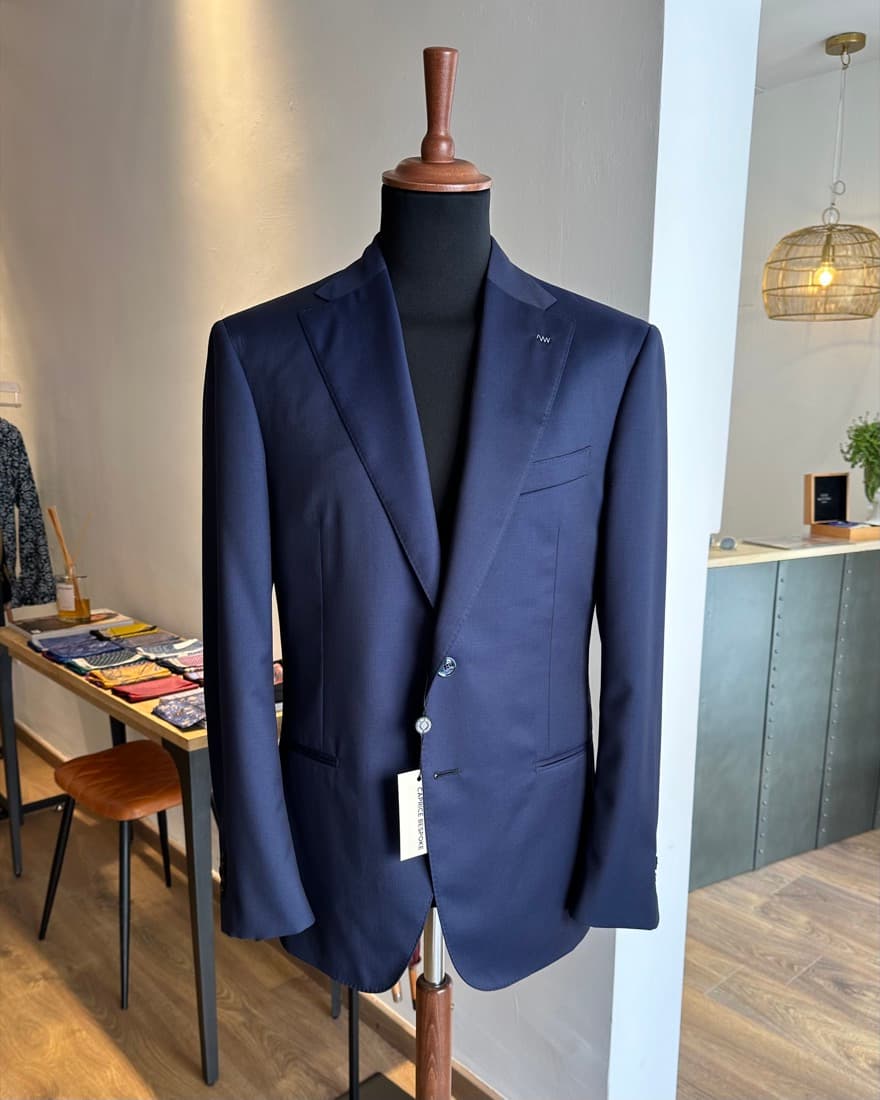 A navy private label tailored jacket made in Italy for a fashion brand