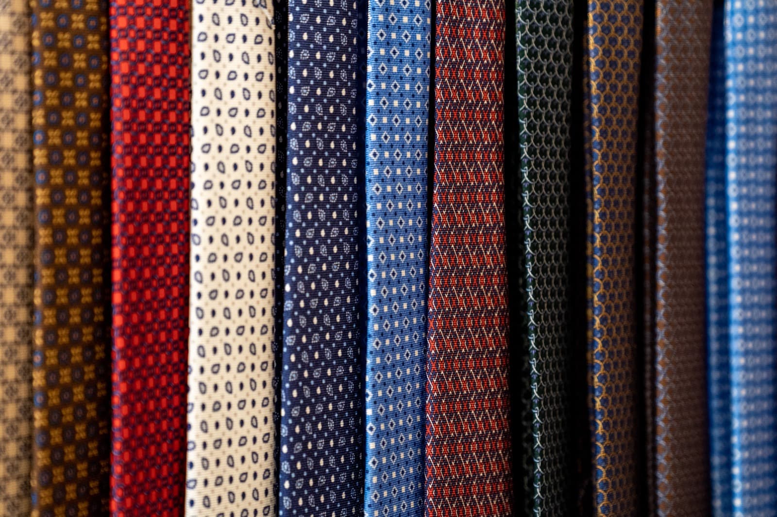 A row of patterned silk neckties in Italian mill cloth