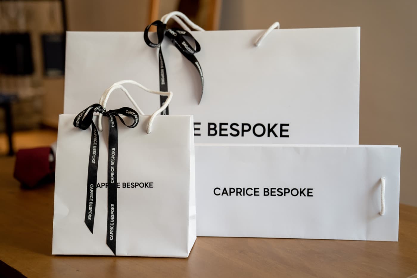 Branded carrier bags and ribbon used to finish a completed retail order
