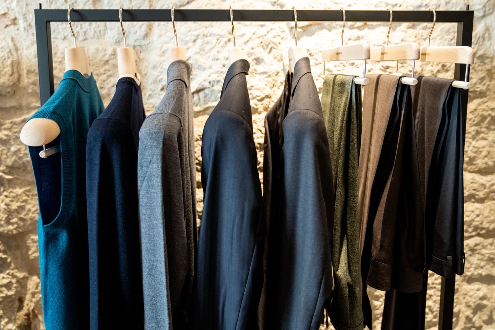 A rail of finished Made-in-Italy garments produced for partner brands inside the Caprice Bespoke atelier