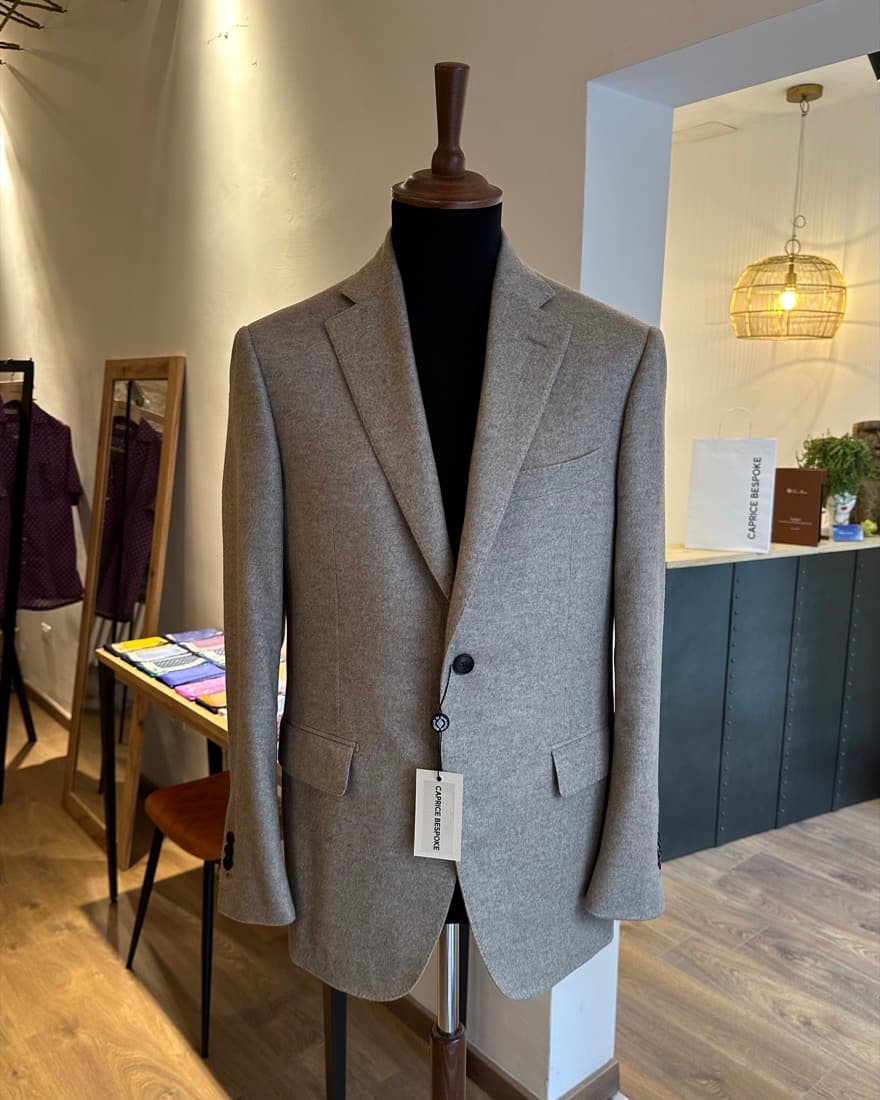 Single-breasted grey jacket in Italian wool flannel on an atelier form